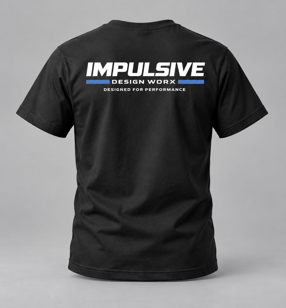 Back of a black Impulsive Design Worx Logo T-shirt with large white and blue branding