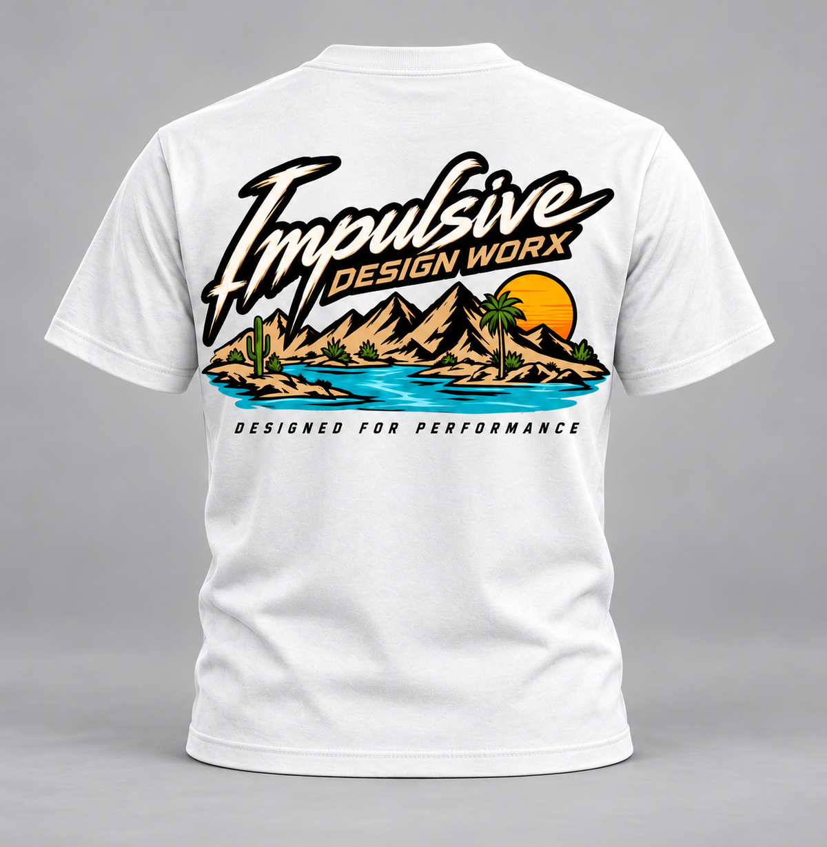 Back of a white IDW River Life T-shirt with mountains, palm trees, and water artwork