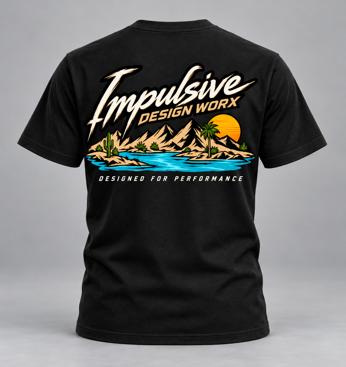 Back of a black IDW River Life T-shirt with mountains, palm trees, and water artwork