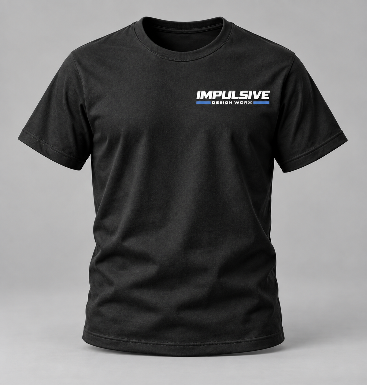 Front of a black Impulsive Design Worx Logo T-shirt with a small white chest logo
